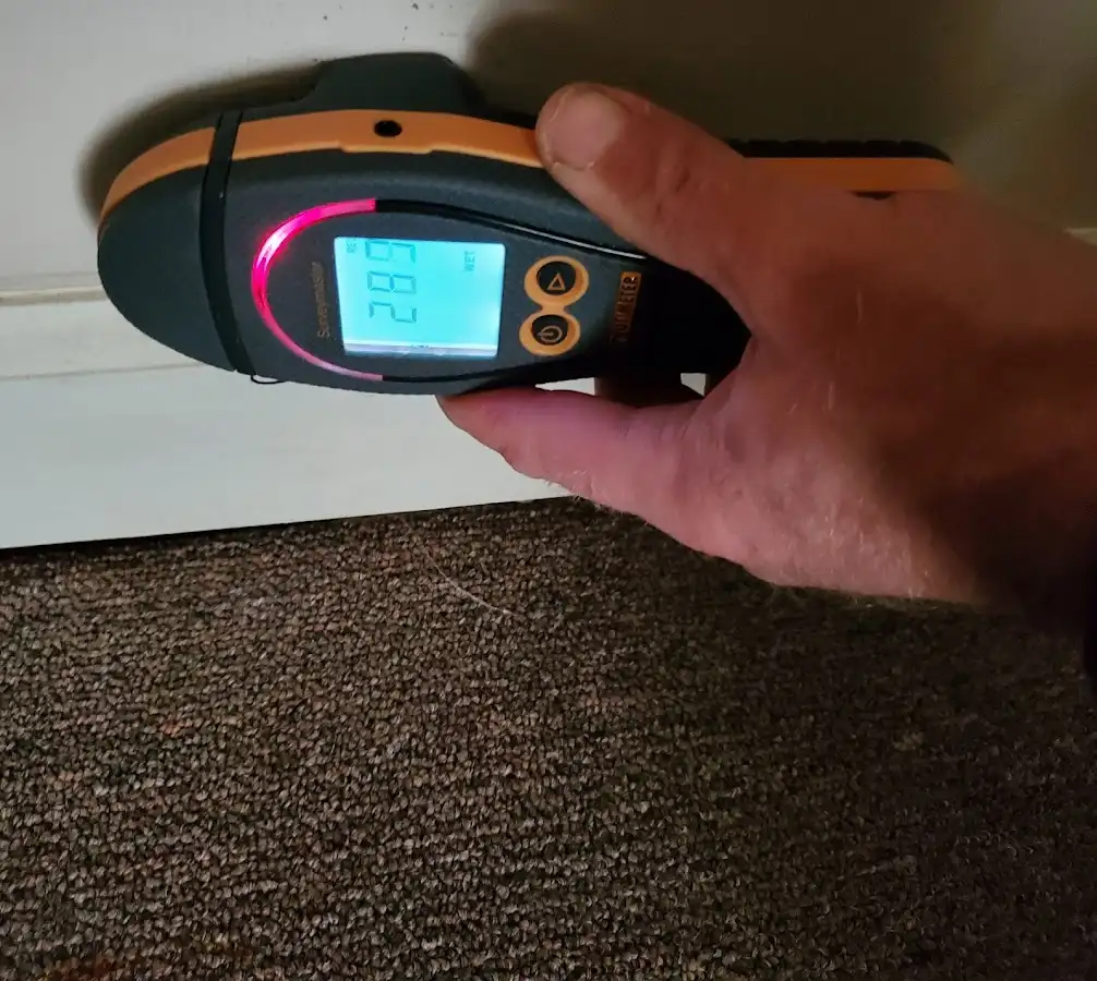 Moisture detection at baseboard during Storm Damage Restoration in Abington